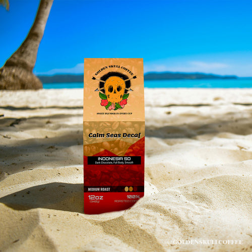 Coffee package labeled 'Calm Seas Decaf' on a sandy beach with ocean view